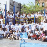 Barbara Barlow (bottom left) with volunteers at a playground build at PS 92 in Harlem, 2000