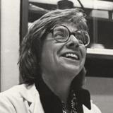 Ruth Bleier sitting at her electron microscope, 1980's