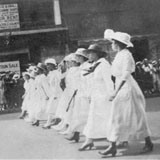 May Edward Chinn (second from right) marching in a suffrage parade on 5th Avenue, 1919