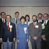 Ruth Dayhoff at the MUMPS Users Group International meeting, an organization which she helped found. Other in picture include: Richard Walters (front row left to right), Jon Diamond, Ruth Dayhoff, Ichiro Wakai, Richard Davis (back row left to right), Mau