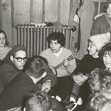 Catherine DeAngelis playing guitar, with fellow students at Wilkes College, 1960s