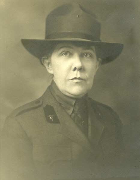 Dr. Loy McAfee, a White woman in uniform and a hat posing for her portrait.