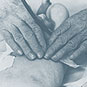 Close-up of Dr. Helen Taussig's hands examining a baby.