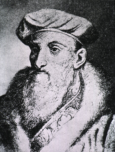 Portrait of full bearded man with a cap 